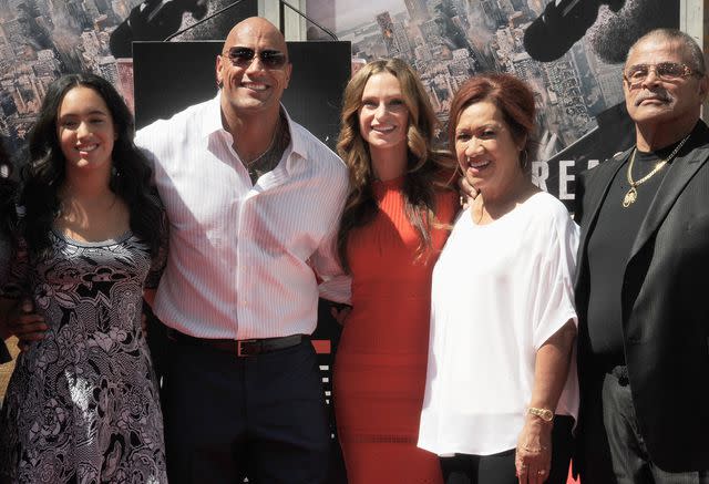 <p>Albert L. Ortega/Getty</p> Dwayne Johnson with his family in 2015