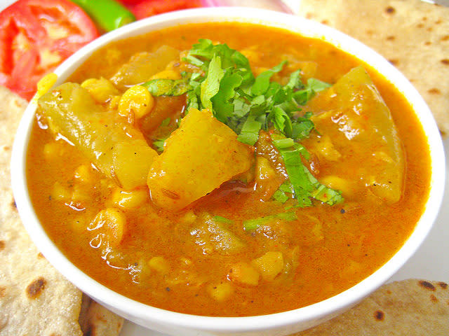 <p>A healthy dal preperation made with Chana dal (bengal gram) & lauki (bottle gourd). Soak 1/2 cup chana dal for 1-2 hours & rinse. In a pressure cooker, add 1 tsp oil & crackle some cumin. Add hing, one chopped onion, one chopped green chili, some ginger & one chopped tomato. Mix well. Add turmeric powder, shili powder & coriander powder to taste. Add rinsed chana dal & one cup chopped lauki with some salt. Add enough water & pressure cook till done. “Creative Commons Lauki Chana Dal” by Soniya Goyal is licensed under CC BY 2.0 </p>