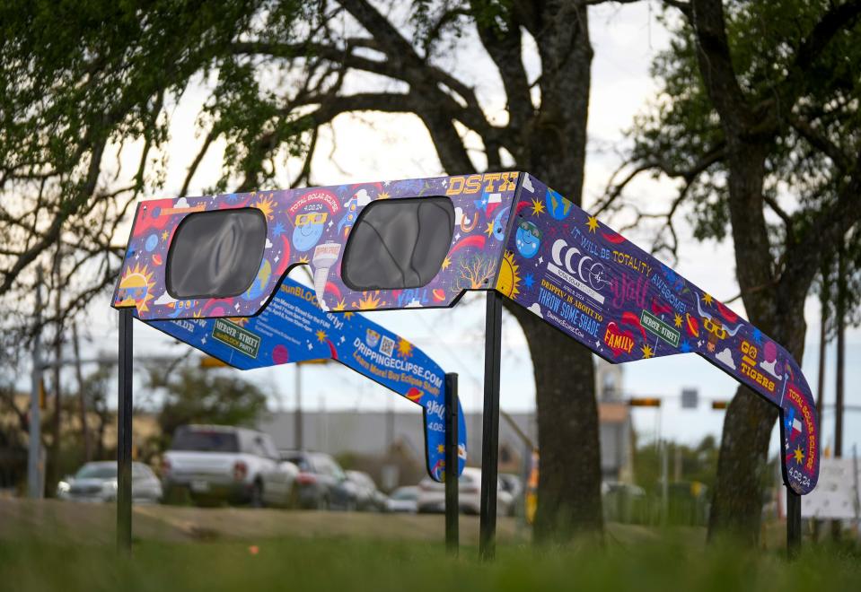 Giant viewing glasses for the April 8 total solar eclipse are set up for public use at Veterans Memorial Park in Dripping Springs Monday March 18, 2024.