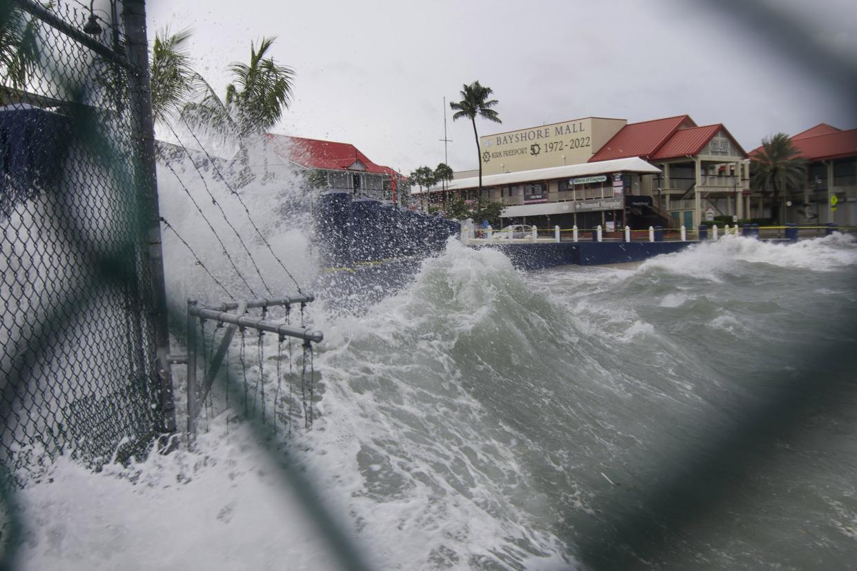 Waves crash against a seawall as Hurricane Ian passes through George Town, Grand Cayman island, Monday, Sept. 26, 2022.