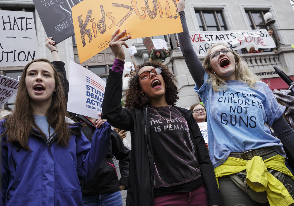 <p>Baylor School student Avery Santin, left, and East Hamilton High School students Haylee Duncan, center, and Lauren Gossett chant on the steps of the Hamilton County Courthouse during a “March for Our Lives” rally on Saturday, March 24, 2018, in Chattanooga, Tennessee. (Doug Strickland/Chattanooga Times Free Press via AP) </p>