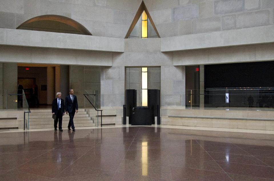 President Barack Obama and Nobel Peace Prize laureate and Holocaust survivor Elie Wiesel enter the Hall of Remembrance as they tour the Holocaust Memorial Museum in Washington, Monday, April 23, 2012. (AP Photo/Carolyn Kaster)