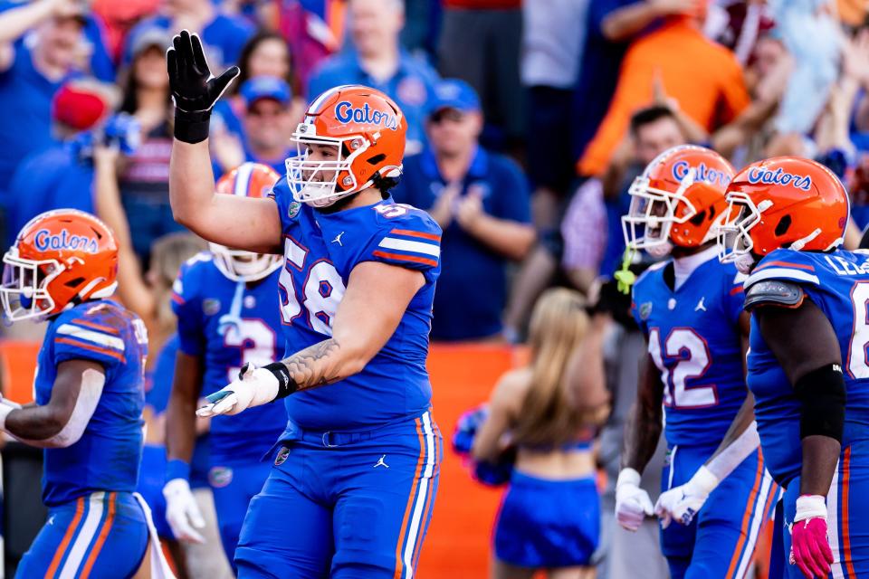 Florida offensive lineman Austin Barber (58) celebrates after a touchdown during the first half against South Carolina.