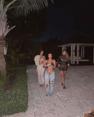 <p>Kim Kardashian/Instagram</p> Kim Kardashian and friends Olivia Pierson and Natalie Halcro getting ready to take photos on vacation, as Kim holds up a digital camera.