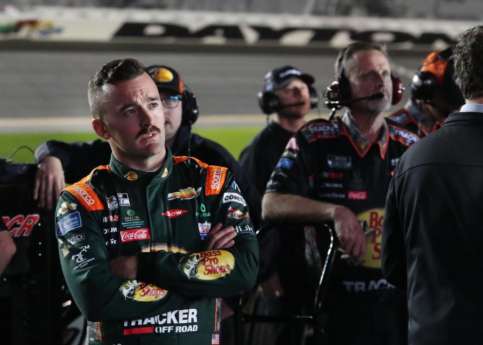 Austin Dillon and crew watch the action on the giant TV screne towering over pit road, Wednesday February 15, 2023 during Daytona 500 qualifying.