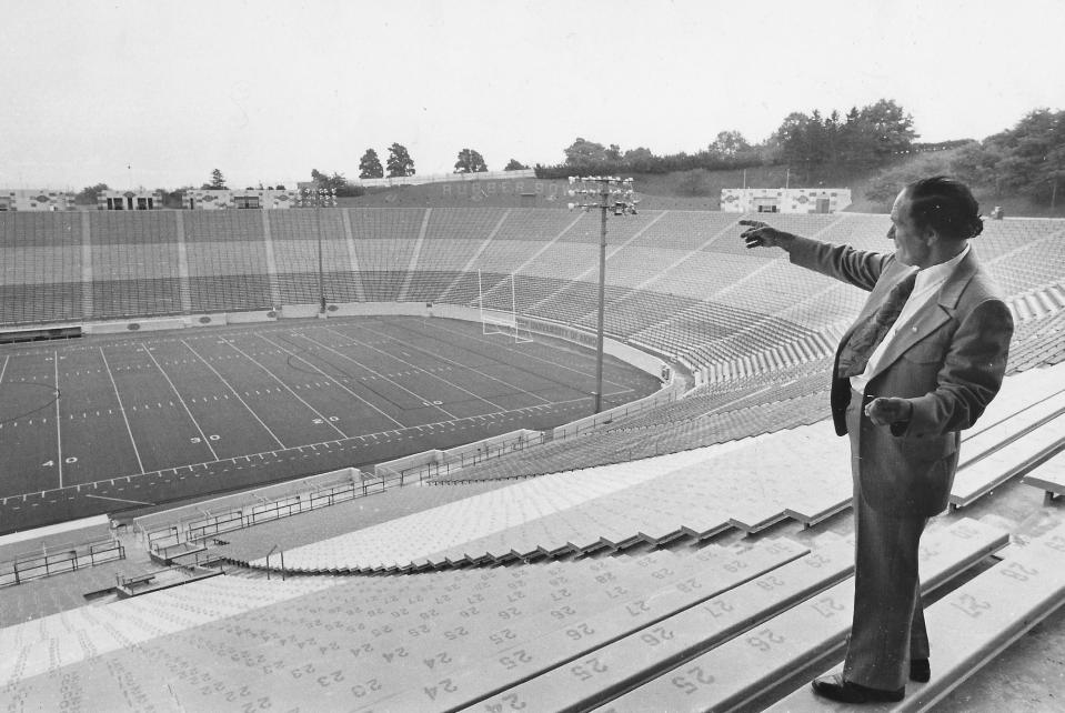 On the day before his famous stunt in 1973, tightrope walker Karl Wallenda points out where he planned to rig the wire across the Akron Rubber Bowl.