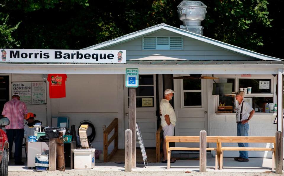 Customers wait for their orders outside the walk-up window at Morris Barbecue in Hookerton. The small restaurant has been serving Eastern N.C. barbecue for four generations.