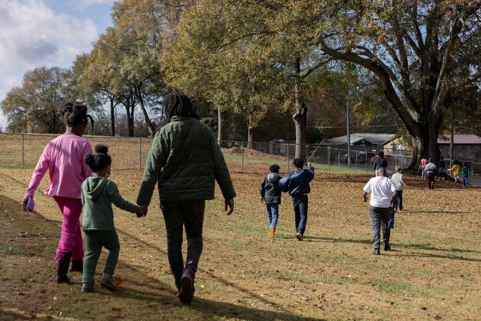 Children participate in an outdoor scavenger hunt during the first day of the two-day Joy Village Music Camp on Monday, Nov. 22, 2021, in Athens. The camp, consisting of about 25 students grades K-8, featured multiple play-based learning activities with a focus on the history of Black music.