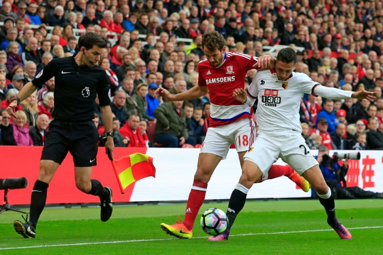 José Holebas (right) clashes with Middlesbrough's Christian Stuani at Riverside Stadium in Middlesbrough on October 16, 2016