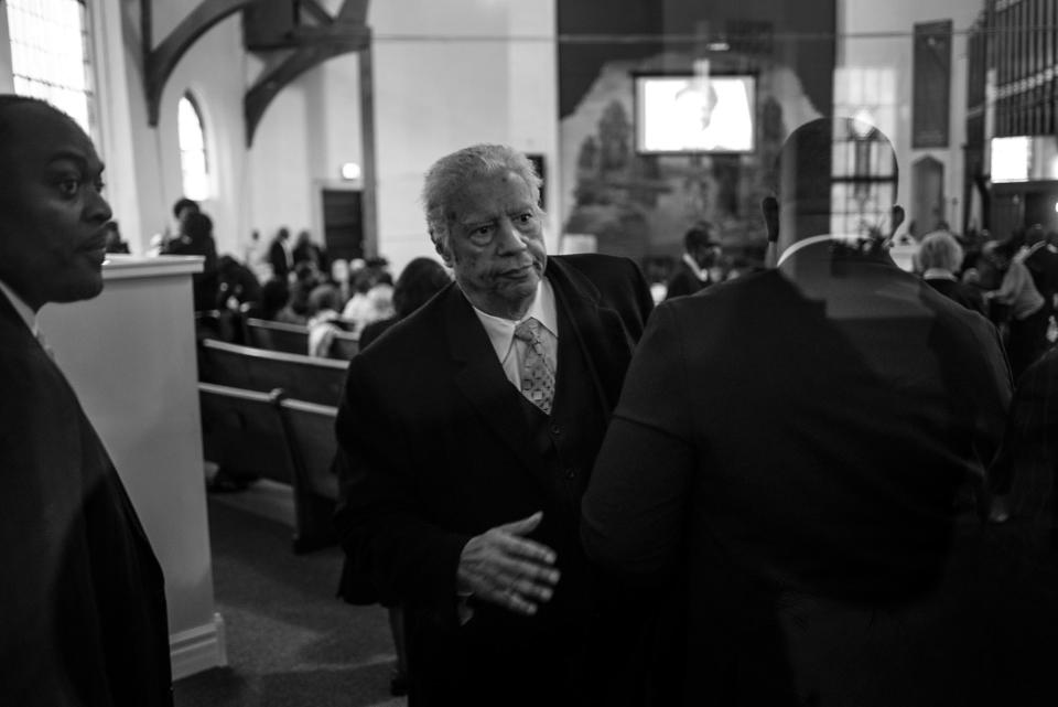 <p>Spencer Leak Sr exits a funeral, his sixth of the day, at Union Tabernacle Missionary Baptist Church on Chicago’s south side. (Photo: Jon Lowenstein/NOOR for Yahoo News) </p>