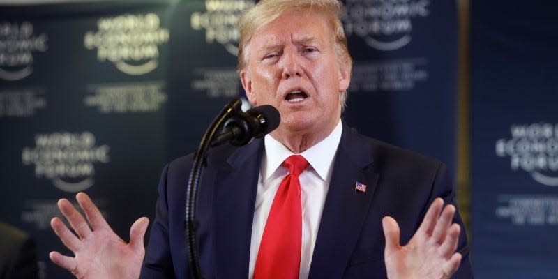 FILE PHOTO: U.S. President Donald Trump gestures as he holds a news conference at the 50th World Economic Forum (WEF) in Davos, Switzerland, January 22, 2020. REUTERS/Jonathan Ernst