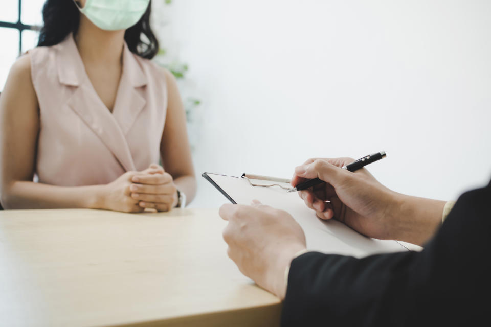 businessman manager and woman wearing protection face during job interview and explaining about his profile in meeting room at office, human resources, business job interview, new normal concept