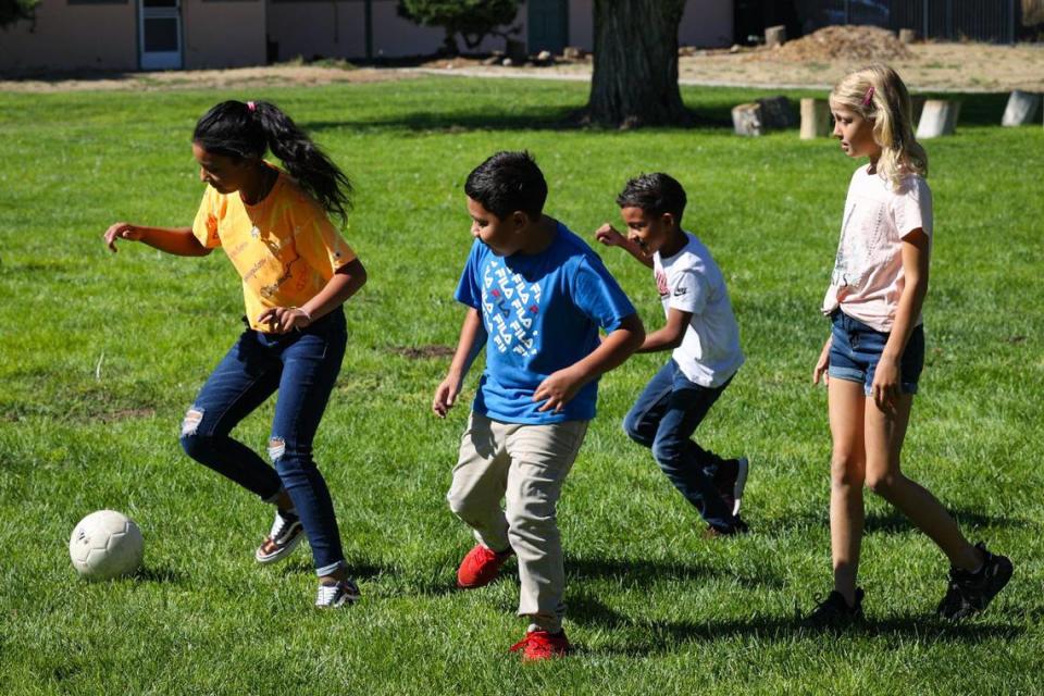 From the left playing soccer at Carrisa Plains Elementary School recess are Zoe Rendon (grade 5), Pablo Murillo (grade 4), Angel Rendon (grade 3) and Lilly Sisco (grade 5).