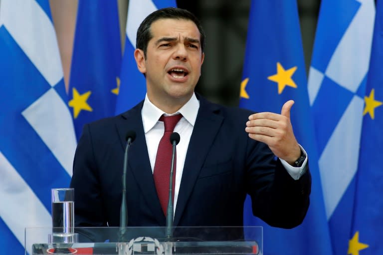 Greek Prime Minister Alexis Tsipras announced his country was 'turning a page' after eurozone ministers declared its crisis over in June