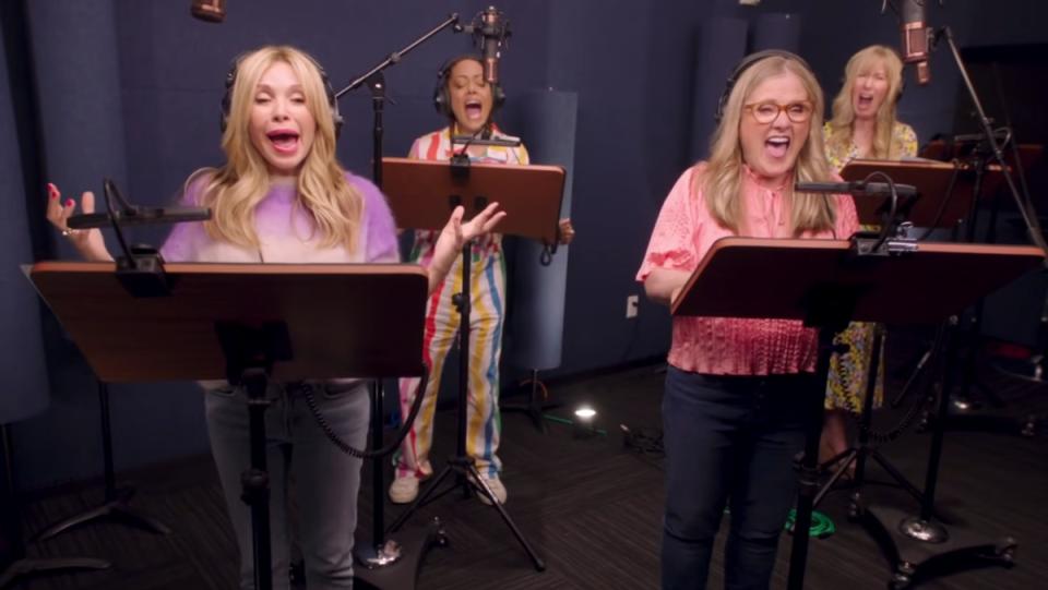 Rugrats voice actors stand together in a studio and scream into microphones