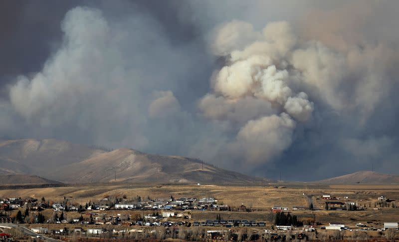 Smoke fills the sky as the East Troublesome Fire burns outside Granby