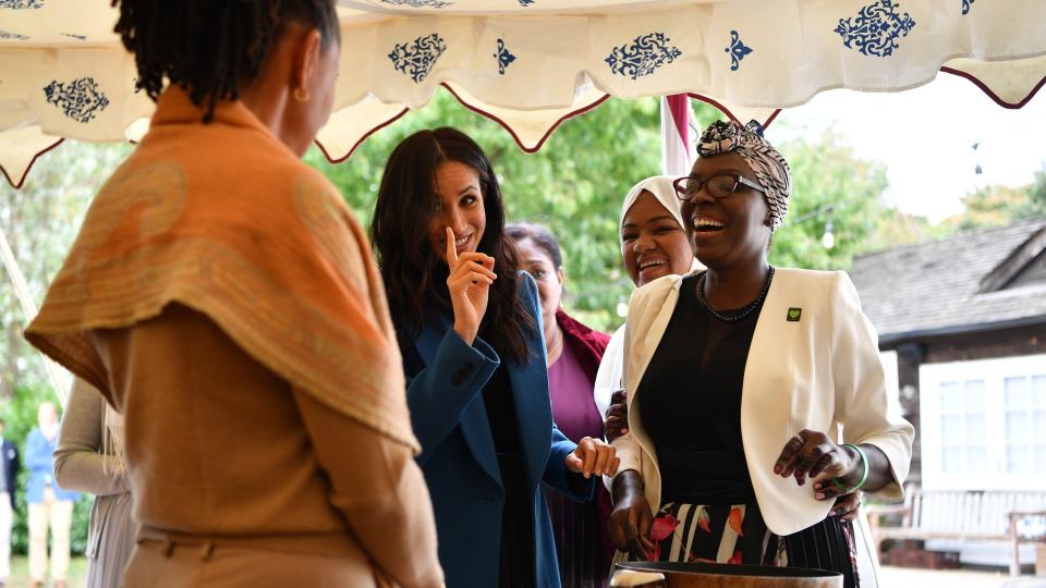 Meghan Markle talking with Doria Ragland