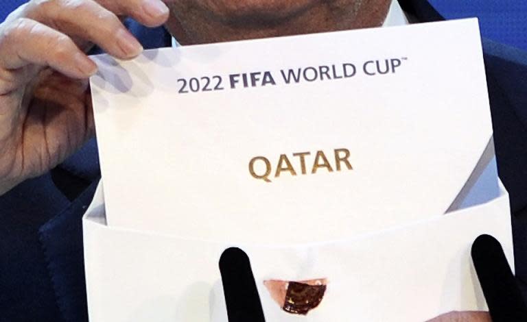 FIFA president Joseph Blatter opens the envelope to reveal that Qatar will host the 2022 World Cup at the FIFA headquarters in Zurich on December 2, 2010