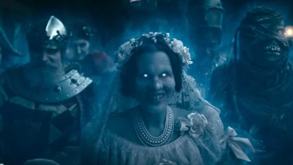 Blue and white ethereal ghosts gather in the Haunted Mansion trailer