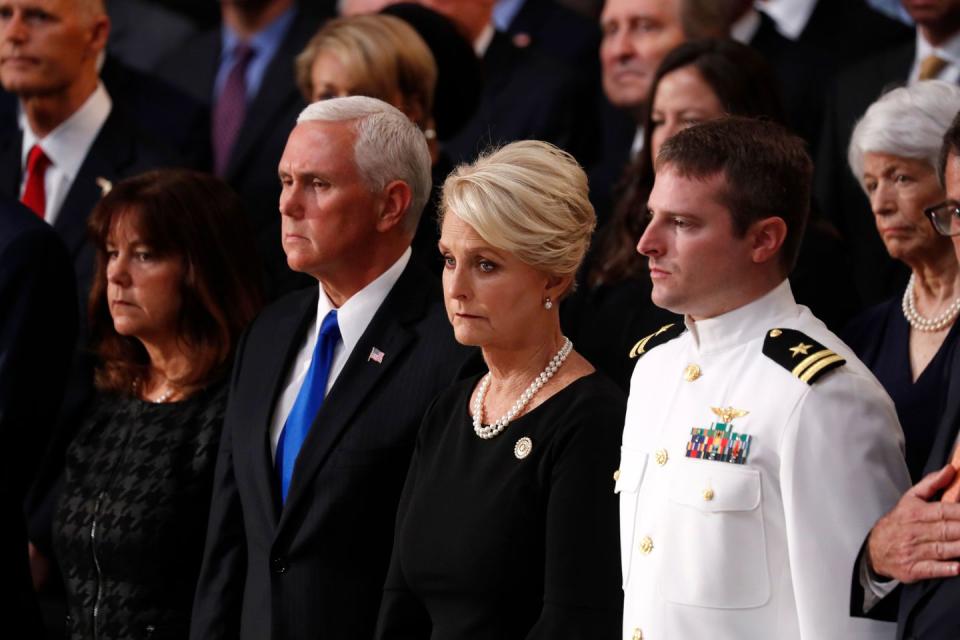 26) Cindy McCain stands with Vice President Mike Pence.