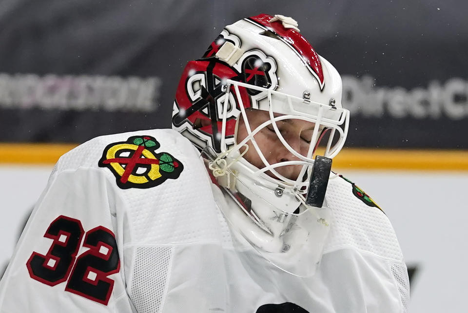 Chicago Blackhawks goaltender Kevin Lankinen blocks a shot against the Nashville Predators in the second period of an NHL hockey game Wednesday, Jan. 27, 2021, in Nashville, Tenn. (AP Photo/Mark Humphrey)