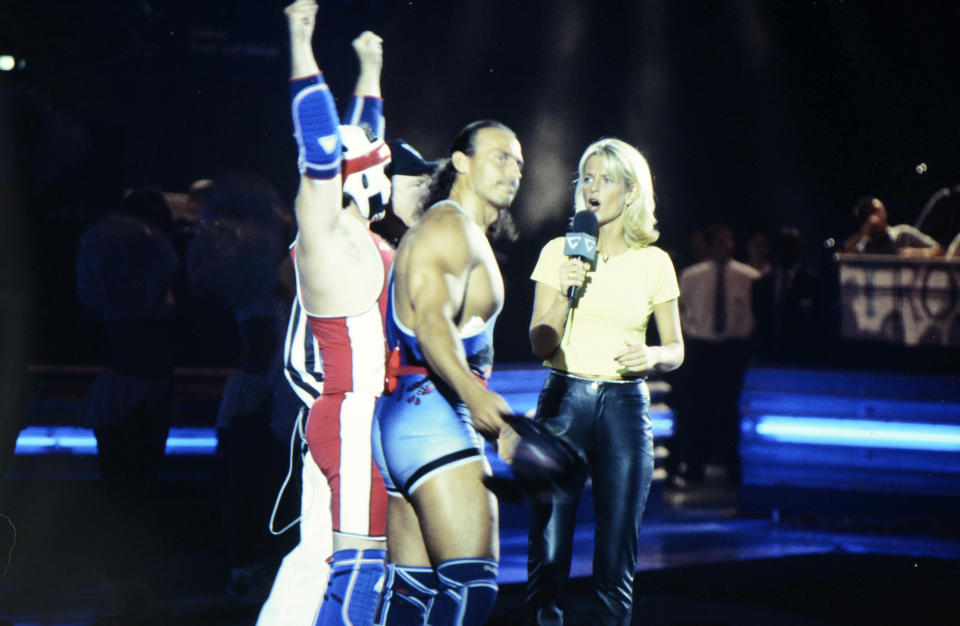 BIRMINGHAM, ENGLAND:  Wolf (Michael van Wijk) and host Ulrika Jonsson during the filming of Gladiators for Comic Relief at the National Indoor Arena in Birmingham, which was shown during the Red Nose Day telethon on March 14, 1997. The event raised over £27m for charitable causes. (Photo by George Bodnar/Comic Relief via Getty Images) (Photo by Comic Relief/Comic Relief via Getty Images)