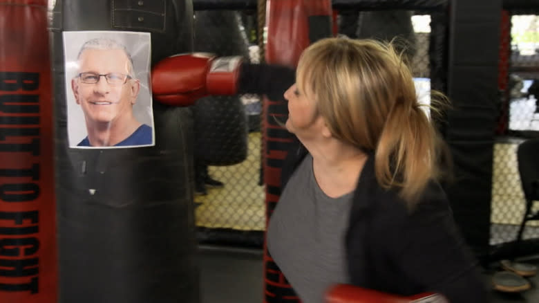 Linda Johnsen hitting a punching bag 