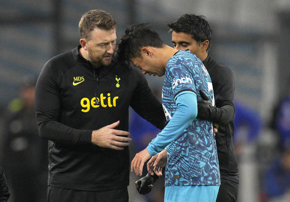 FILE - Tottenham's Son Heung-min receives treatment after taking a knock during the Champions League Group D soccer match between Marseille and Tottenham Hotspur at the Stade Velodrome in Marseille, France, Tuesday, Nov. 1, 2022. South Korea captain Son Heung-min will undergo surgery on a facial injury, jeopardizing his availability for the World Cup in Qatar. (AP Photo/Daniel Cole, File)