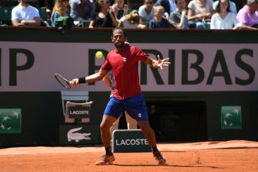 Egypt's Mohamed Safwat plays a return to Grigor Dimitrov on Philippe Chatrier Court