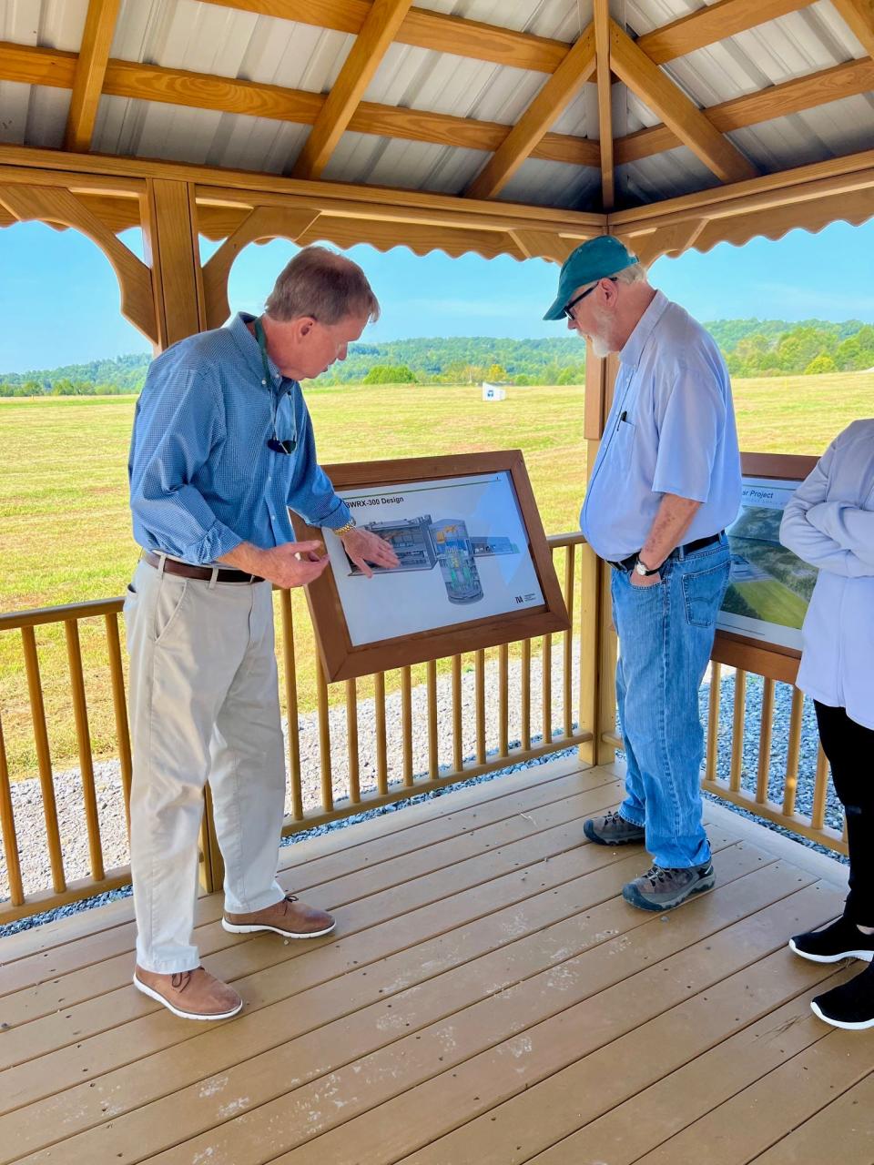 TVA Senior Vice President Bob Deacy, left, walks the delegation through a description of the Clinch River Nuclear Site and the small modular reactor proposal as Anderson County Commissioner Stephen Verran looks on.