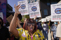 Producer Cheryl Rich joins protesters outside the Netflix building in the Hollywood section of Los Angeles, Wednesday, Oct. 20, 2021. Critics and supporters of Dave Chappelle's Netflix special and its anti-transgender comments gathered outside the company's offices Wednesday. (AP Photo/Damian Dovarganes)