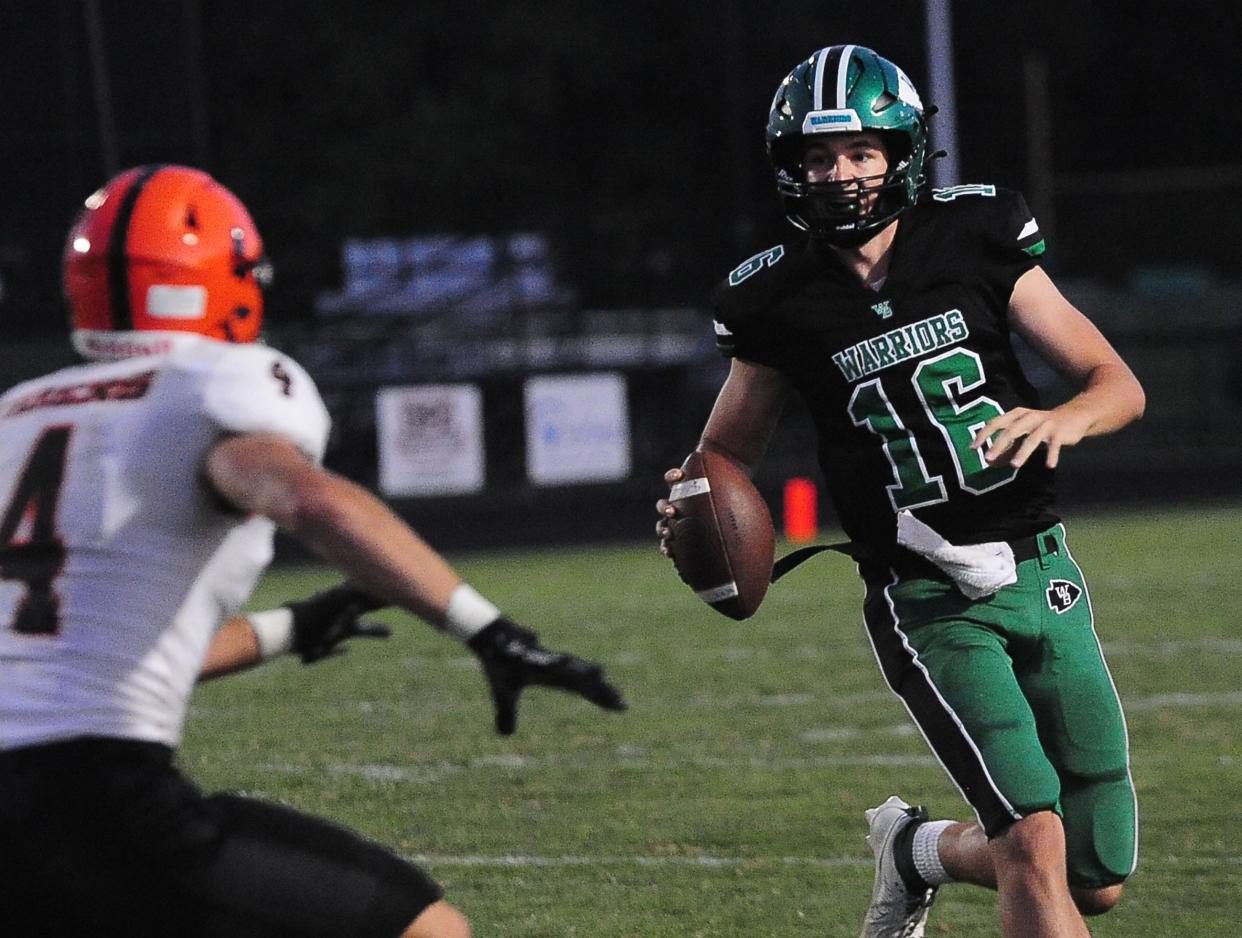 West Branch's Beau Alazaus looks downfield for a receiver against Howland, Friday Sept. 15, 2023.