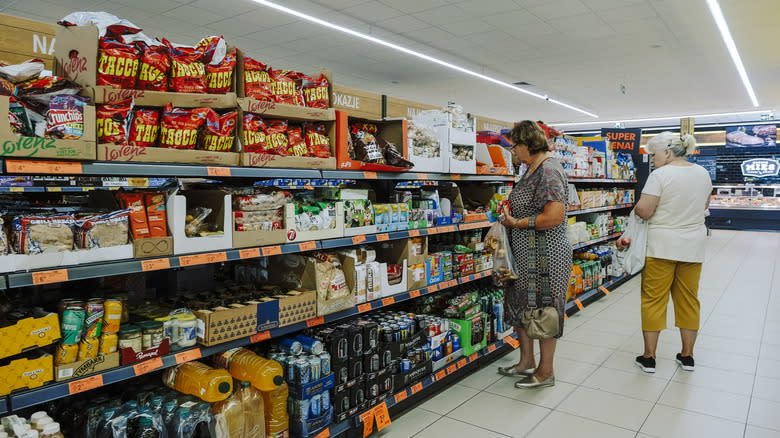 People walking in grocery store