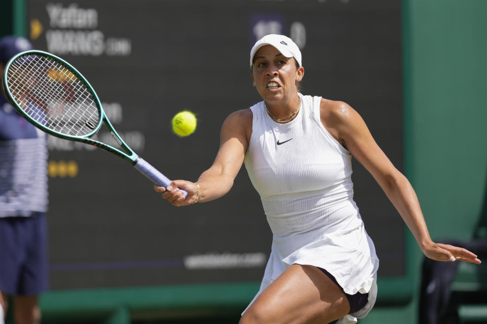 Madison Keys of the United States plays a forehand return to Yafan Wang of China during their second round match at the Wimbledon tennis championships in London, Thursday, July 4, 2024. (AP Photo/Alberto Pezzali)