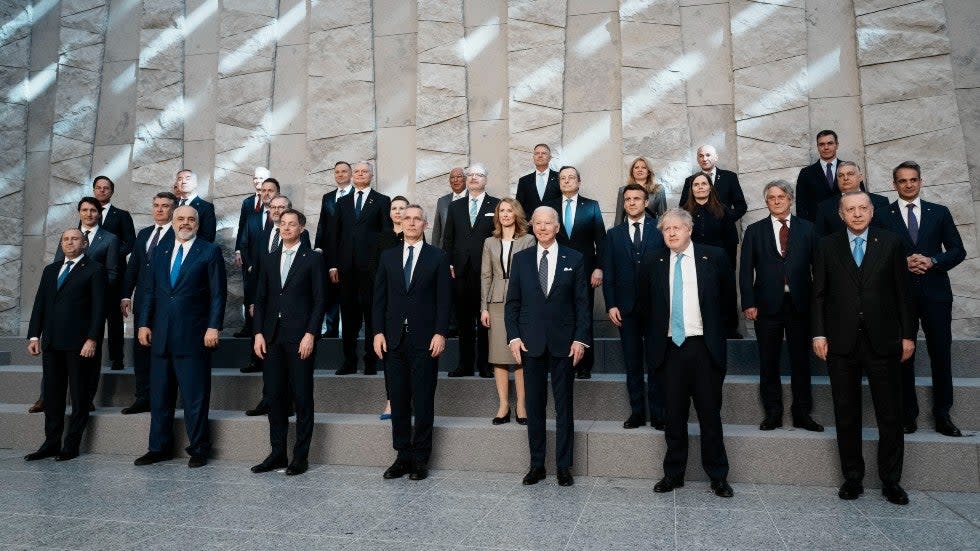 NATO heads of state pose for a group photo during an extraordinary NATO summit at NATO headquarters in Brussels