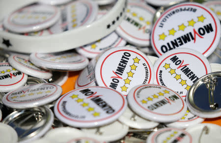 5-Star movement badges are seen during a gathering in Rimini, Italy, September 23, 2017. REUTERS/Max Rossi