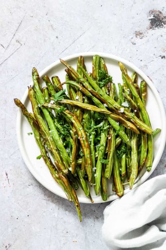 <p>Recipes from a Pantry</p><p>These Air Fryer Green Beans are the perfect mix of easy, quick and oh so tasty vegetable treat. The beans are cooked in very little low-calorie cooking oil making them a healthier treat. Whip up a batch or two for a snack, dinner side or a lunch bowl filler.</p><p><strong>Get the recipe: </strong><a href="https://recipesfromapantry.com/air-fryer-green-beans/" rel="nofollow noopener" target="_blank" data-ylk="slk:Easy Air Fryer Green Beans;elm:context_link;itc:0;sec:content-canvas" class="link "><strong>Easy Air Fryer Green Beans</strong></a></p>