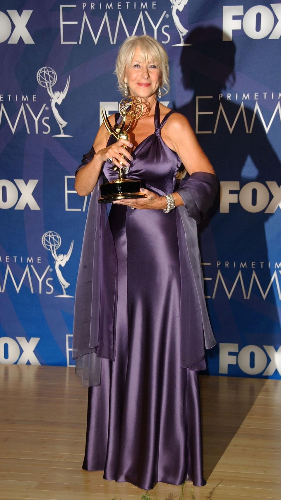 Helen Mirren in a long purple dress