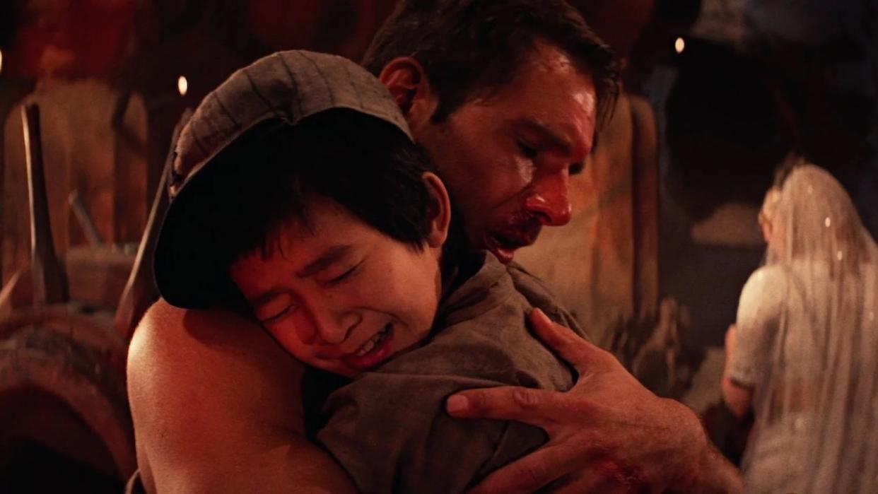  Indiana Jones hugging Short Round in Temple of Doom. 