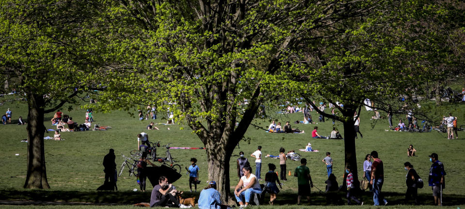 People leave home for the outdoors as the temperature hovered around 70 degrees, even as the stay-at-home order remained in effect with Governor Andrew Cuomo warning that any change in behavior could reignite the spread of coronavirus, Saturday, May 2, 2020, in Brooklyn's Prospect Park in New York. (AP Photo/Bebeto Matthews)