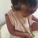 <p>It goes without saying that baby North West has great taste. So it’s no surprise that she gravitated toward Kanye’s diamond and gold chain necklace. On Friday, Kim Kardasian posted a picture of Nori rocking her father’s bling with the caption: “No Daddy’s it’s me necklace.” Though it must’ve weighed almost as much as the tiny tot, the sparkly accessory looked fabulous layered atop her pink dress.</p>