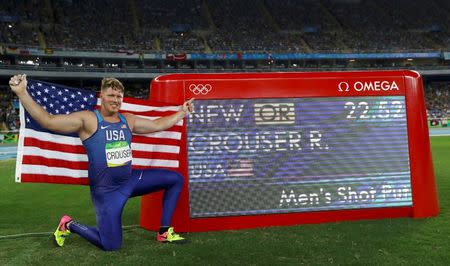 2016 Rio Olympics - Athletics - Final - Men's Shot Put Final - Olympic Stadium - Rio de Janeiro, Brazil - 18/08/2016. Ryan Crouser (USA) of USA celebrates winning the gold medal and setting a new Olympic record. REUTERS/Kai Pfaffenbach