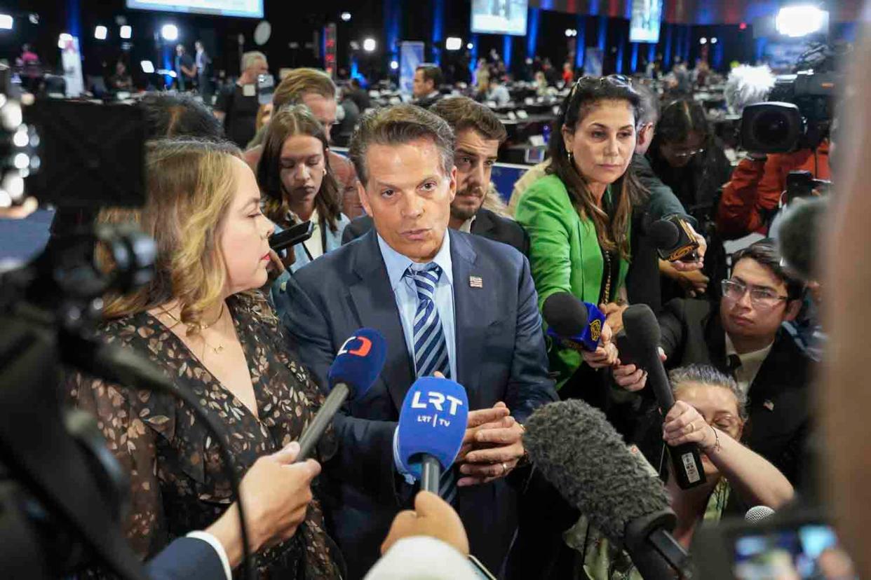 Former Pence aide Olivia Troye, left, and Former White House communications director Anthony Scaramucci speak to media in the spin room before the ABC News Presidential Debate in Philadelphia on Sept. 10, 2024.