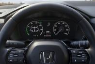 <p>Partly digital gauge cluster features an analog speedometer. Sport Touring model pictured.</p>