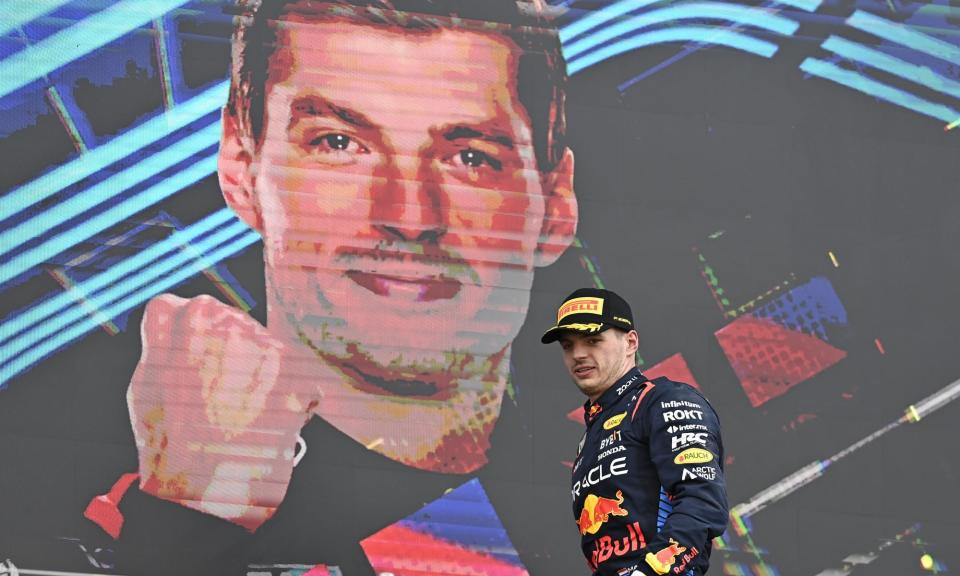 <span>Max Verstappen heads up to the podium in Suzuka in front of a large image of himself after winning Sunday’s Japanese Grand Prix.</span><span>Photograph: Anadolu/Getty Images</span>