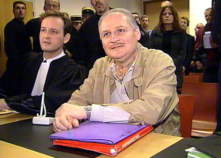 FILE PHOTO: Ilich Ramirez Sanchez, better known as "Carlos the Jackal" (R) seated next to his lawyer Francis Vuillemin (L) in court in Paris, France November 28, 2000. REUTERS/RTV/Thierry Chiarello/File Photo