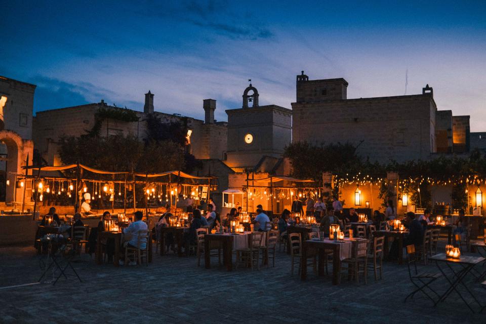 Borgo Egnazia’s piazza is lit up in the evening for dinner.