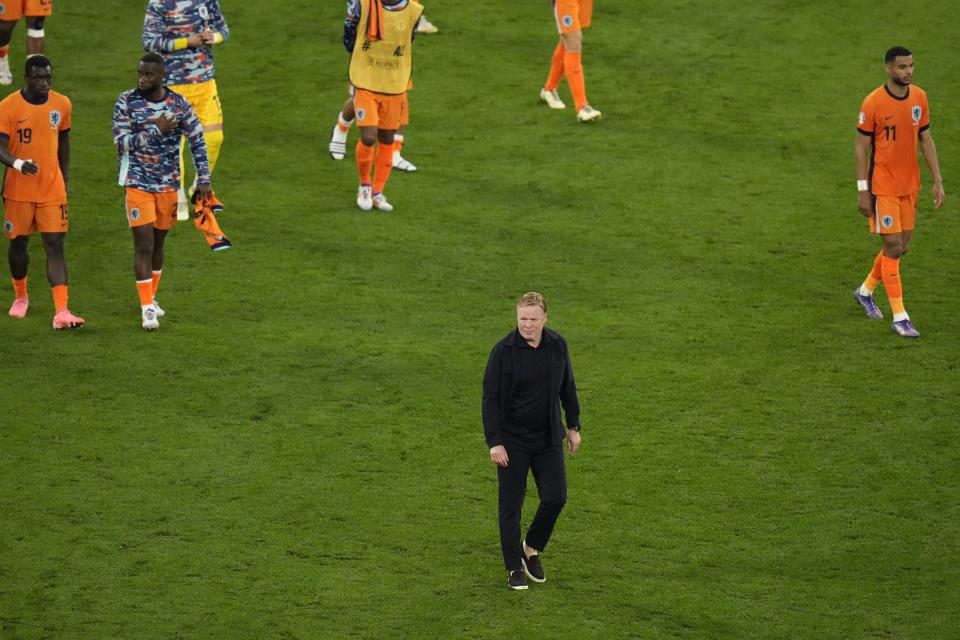 Netherlands head coach Ronald Koeman walks after losing a semifinal match against England at the Euro 2024 soccer tournament in Dortmund, Germany, Wednesday, July 10, 2024. (AP Photo/Hassan Ammar)