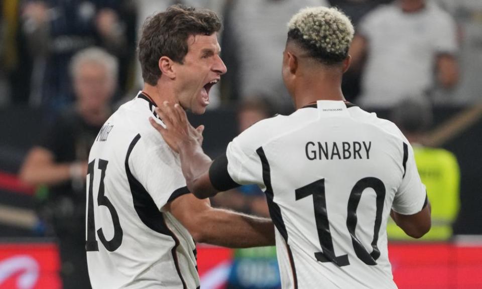 Thomas Müller celebrates scoring against France