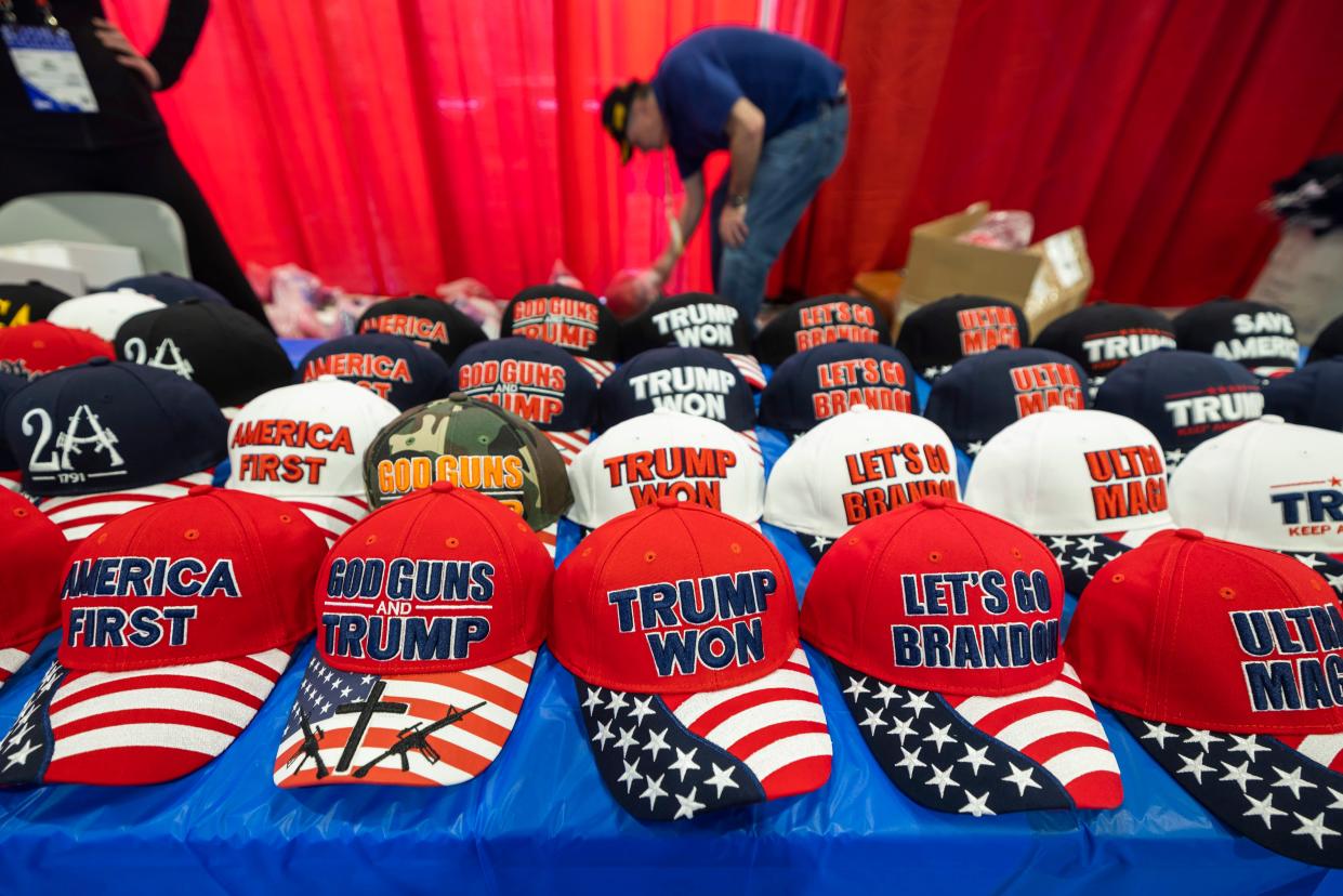 Vendors set up inside CPAC’s 2023 event in Maryland on 1 March. (EPA)